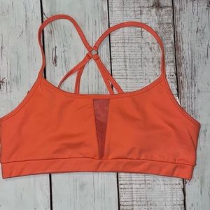 Junior’s Bright orange sports bra w/ criss cross back *NWOT*. Size medium.